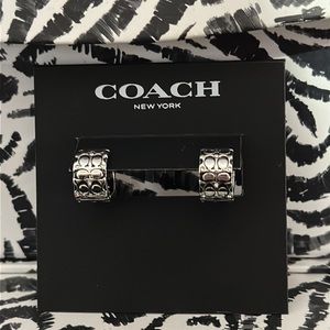 Coach silver and black quilted huggie earrings.